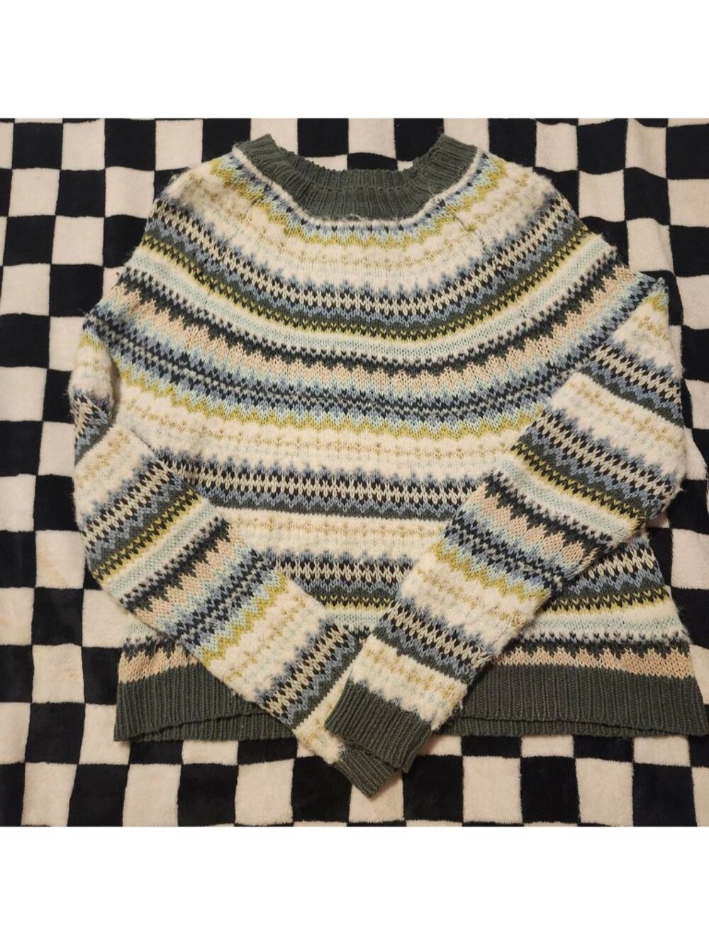 Multi-colored striped sweater with geometric patterns in cream